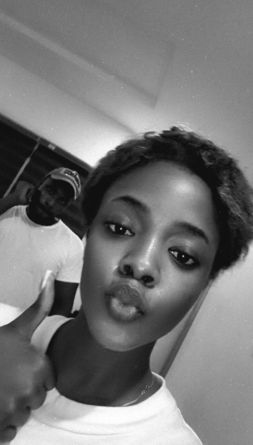 A playful black-and-white selfie of Toms